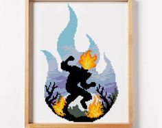 a cross - stitch picture of a man running in front of a fire and flames