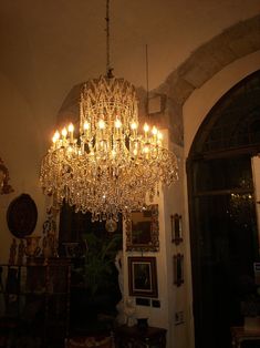 a chandelier hanging from the ceiling in a room