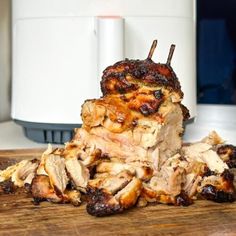 the meat is piled high on the cutting board