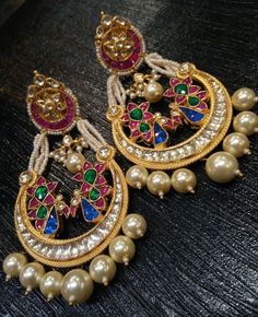 *It's Handmade Milticolor Indian Ethnic Kundan Earrings. *It's made from Silver n Copper with Multi color Kundan Stones Settings with 22k gold Plating as shown in picture. *It it Pure Ethnic Look with Antique Touch and 3 inches Long. *Our all jewelry is made from semiprecious stones and beads. *WARRANTY: ITS GENUINE HANDMADE JEWELRY AND WE ARE GIVING LONG LIFE WARRANTY FOR OUR ALL ITEMS. All of our Kundan Jewelry is 100% handmade with ancient Kundan stone setting method using silver foils. It is Kundan Pearl Earrings For Festivals In Temple Jewelry Style, Kundan Meenakari Chandbali Pearl Earrings, Multicolor Chandbali Bridal Earrings With Intricate Design, Traditional Heavy Kundan Pearl Earrings, Multicolor Intricate Chandbali Bridal Earrings, Temple Jewelry Pearl Earrings With Stone Work, Kundan Chandbali Earrings In Temple Jewelry Style, Kundan Chandbali Temple Jewelry Earrings, Temple Jewelry Pearl Chandbali Earrings With Meenakari