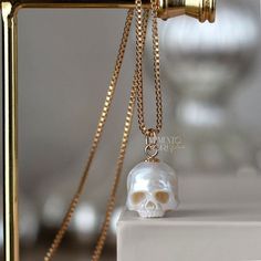 💀PEARLS: Genuine White Freshwater Pearl 💀SIZE: Ranging in size, from 10 to 11mm excluding the bail 💀NECKLACE : -14Kt Yellow Gold Filled - Box Chain 1mm 18 - 24 inches -925 Sterling Silver - Box Chain 1mm 18 - 24 inches -14K Yellow Gold - 1.2 mm Rounded Box Chain 18 inches 💀BAIL METAL: 14k Yellow Gold Filled 925 Sterling Silver 14k Yellow Gold 💀 BAIL SIZE: The gold-filled bail is 5 mm Sterling Silver bail is 5 mm. 14k gold bail is 5 mm Please contact me if you need to customize it. 💀 Authentic Metal Quality Guaranteed! Rest assured that all the metal qualities mentioned in the description are accurately represented. Occasionally, due to the small size of the product, a hallmark may not be stamped onto the item. You can verify the authenticity of the metal at any local jewelry store. W Luxury Skull Jewelry For Gifts, White Skull Shaped Jewelry Gift, Luxury Skull Shaped Jewelry For Gift, Pearl Skull, Carved Pearl, Fantasy Earrings, Gothic Pendant, Snake Jewelry, Vintage Jewelry Necklace