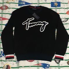 Mens Medium New With Tags Fall Streetwear Street Wear Supreme Fashion Style Colorful Logo Spellout Spell Out Tommy Hilfiger Sporty Black Tops, Tommy Hilfiger Black Tops For Fall, Black Tommy Hilfiger Tops For Fall, Tommy Hilfiger Black Crew Neck Top, Tommy Hilfiger Black Long Sleeve Top, Tommy Hilfiger Winter Streetwear Tops, Casual Tommy Hilfiger Winter Tops, Casual Tommy Hilfiger Tops For Winter, Winter Casual Tops By Tommy Hilfiger