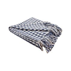 the blue and white checkered blanket is folded on top of another piece of cloth