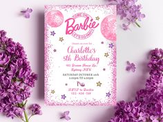 a pink and white birthday party with purple flowers on the side, next to it is a card that says barbie