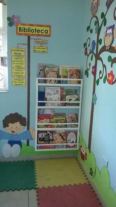 a child's playroom with bookshelves and floor mats on the floor