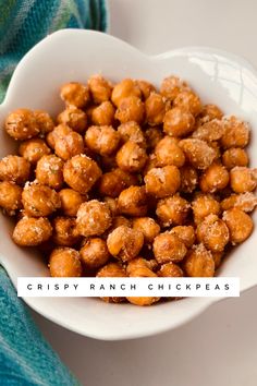 crispy ranch chickpeas in a white bowl on top of a blue towel