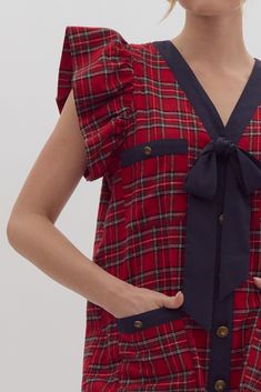 You'll love this Jingle Bell Plaid Tweed Dress! It's perfect for festive occasions and will have you jingling all night long! Get ready to slay in this playful Jingle Bell Plaid Dress! Featuring a plaid print, button-up front, and self-tie detail at the bust, this mini dress is sure to make a statement. With front pockets, ruffled sleeves, and a lightweight, non-sheer woven material, you'll feel both stylish and comfortable. Plus, it's lined for extra quality!