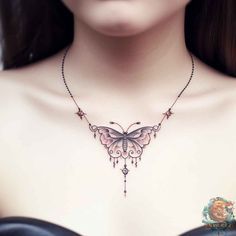 a woman wearing a black bra with a butterfly tattoo on it's chest and necklace