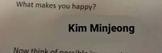 a close up of a piece of paper with the words kim minjeong written on it