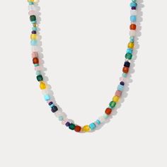 Add a pop of color to your summer looks with our Colorful Seed Bead Necklace! This playful and charming necklace features a rainbow of pastel beads that will add a touch of elegance and cheer to any outfit. Whether you're lounging on the beach or dancing at a party, this necklace is the perfect accessory to elevate your fashion and style. Don't be afraid to stand out and make a statement with this breezy summer must-have! DETAILS Plating: 18K Gold Materials: 18K Gold on Brass, Natural Stones Mea Trendy Multicolor Single Strand Necklaces, Trendy Multicolor Single Strand Necklace, Colorful Letter Beads Necklace For Summer, Colorful Summer Necklaces With Letter Beads, Colorful Summer Letter Beads Necklace, Multicolor Beads For Summer Jewelry Making, Rainbow Colored Letter Beads Necklace For Summer, Rainbow Letter Beads Necklace For Summer, Rainbow Letter Beads Necklaces For Summer