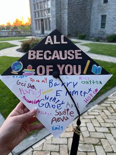 someone is holding up a graduation cap with writing on it that says, all because of you