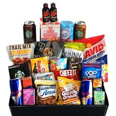 a black box filled with lots of different types of snacks and drinks on top of each other