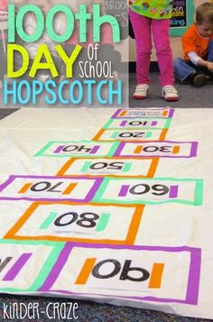 two children sitting on the floor playing with their numbers and counting mats in front of them