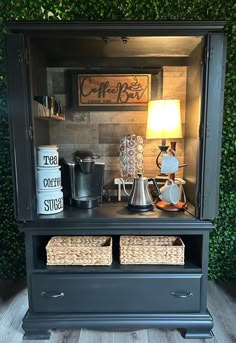 a coffee bar with two baskets on the top and one drawer open to show items