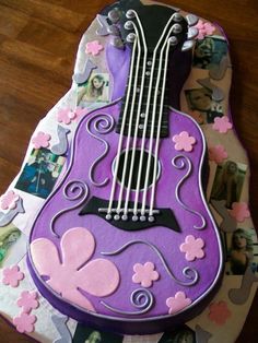 a cake shaped like a guitar on top of a table