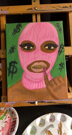 a painting of a person with a pink mask on