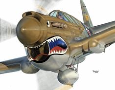 an airplane with a shark's mouth painted on it