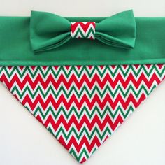 a green and red dog bandana with a bow tie on it's side