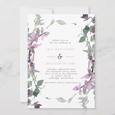 a wedding card with purple flowers and greenery