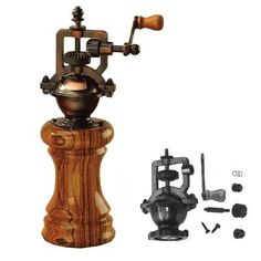 an old fashioned coffee grinder is shown next to some other tools and accessories on a white background