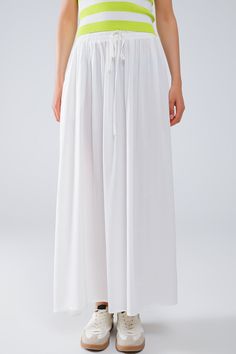 Introducing our stunning Maxi Skirt in White Fluid Fabric with Elastic Waist, a versatile and chic addition to your wardrobe that exudes effortless bohemian style. Crafted from lightweight woven fabric made of 100% viscose, this skirt offers both comfort and elegance.  The full-length design and relaxed fit create a flowing silhouette that's perfect for any occasion, whether you're strolling along the beach or attending a summer soirée. The elastic waistband ensures a comfortable and customizable fit, while side pockets add a practical touch.  Pair this skirt with a simple tank top for a casual daytime look, or dress it up with a blouse and statement jewelry for a more polished ensemble. However you style it, this maxi skirt is sure to make a statement wherever you go.  Please note that th Flowy Maxi Skirt, Simple Tank Tops, Flowy Maxi Skirts, Boho Fabric, Summer Soiree, Skirt Jumpsuit, Scarf Headband, Estilo Boho, Romper Pants