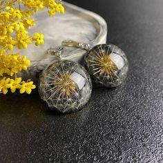 Buy real handmade dandelion earrings. Earrings made from real dried dandelion fluff and high quality jewelry resin. The product has undergone step-by-step manual grinding and polishing with a professional tool. Earrings size: 3 cm/ 1.18 inch The weight of one earring is 8.5 grams The earrings is sent individually packed with a special napkin for the care of the jewelry. This earrings can be a special gift for mom, sister or friend. You will see this real sleepybone earrings that sparkles in the sunlight because the resin provides the perfect finish. Note that the image and colors may vary slightly, depending on the configuration and lighting of your monitor. 🌸If you had any questions about my items please contact me and I will be absolutely happy to answer them to you 🌸 Each handmade ite Dandelion Earrings, Dried Dandelion, Dandelion Fluff, Special Gifts For Mom, One Earring, Jewelry Resin, Wedding Jewelry Earrings, Black Earrings, Keep Jewelry