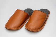 ~ Handmade warm genuine brown leather and black merino wool slippers for women with leather sole. ~ Made of high quality and natural merino wool, which let your skin breath and feet will not be sweating. It's a perfect gift for yourself and for your friends. ~ Sizing: Measure your foot by tracing it on a piece of paper. Make sure to keep the pencil/pen at 90 degrees to the surface of the paper. Measure the longest distance between your heel and toes. Slipper sizes according to the length of your Mens House Shoes, Yellow Slippers, Personalized Slippers, Black Slippers, Wool Slippers, Pencil Pen, Slippers For Women, Warm Slippers, Leather Slippers