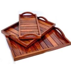 three wooden serving trays on top of each other