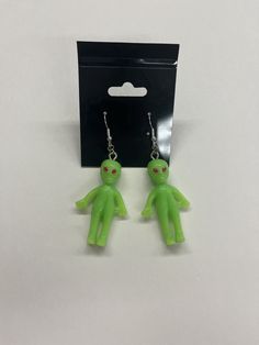 These little green men came from space to rest on your ears! These cute earrings are out of this world! Packing size is just a filler number as we don't have boxes currently! Fun Green Nickel-free Earrings, Green Fun Earrings For Gift, Green Fun Earrings For Gifts, Fun Green Earrings For Gifting, Fun Green Earrings For Gifts, Green Dangle Earrings With Fun Style, Quirky Handmade Green Jewelry, Fun Green Jewelry For Gifts, Green Fun Drop Earrings