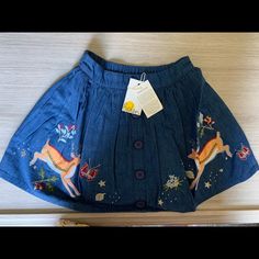 Adorable Denim-Blue Skirt Featuring Prancing Reindeer From Mini Boden. New With Tags, Never Worn. Size 110 Or 4-5 Years Old. Cute Cotton Skirt For Fall, Cute Blue Cotton Denim Skirt, Cute Blue Cotton Skirt, Cute Denim Blue Skirt, Blue Mini Skirt With Lining, Blue Embroidered Mini Skirt, Playful Blue Cotton Skirt, Blue Mini Skirt With Gathered Detail, Unicorn Skirt