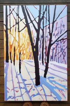 a painting of trees in the snow on a wooden wall next to two pairs of shoes