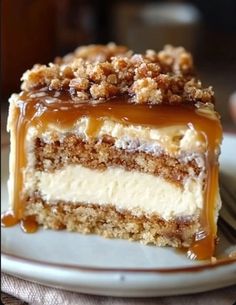 a piece of cake on a plate with caramel drizzle