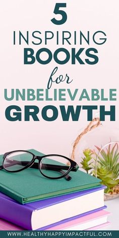 a stack of books sitting on top of a table next to a potted plant