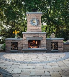 a brick fireplace with a clock on the top