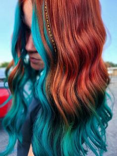 Western Copper Hair, Ginger Hair With Pop Of Color, Burgundy And Teal Hair, Orange And Blonde Hair Color, Copper Hair With Peekaboo Color, Ginger Hair With Blue Streaks, Ginger Hair With Color, Amber Hair With Blonde Highlights, Auburn And Teal Hair