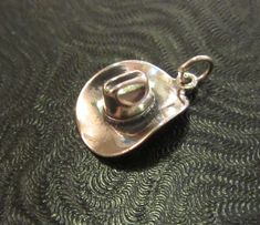 This is a new sterling silver 3D well made Cowboy Hat charm pendant. It is in mint condition. Thanks for looking ! Adjustable Silver Hat As Gift, Cowboy Hat Jewelry, Cowboy Hat Keychain, Cowboy Hat Pendant, Silver Horseshoe Charms Jewelry, Nickel-free Silver Horseshoe Jewelry, Winged Horse, Photo Gold, Silver Bells