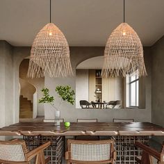 a dining room table with chairs and lights hanging from the ceiling