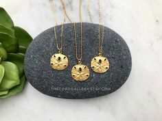 Matte Vermeil Gold Sand Dollar Medallion Pendant Necklace --- International Buyers: Please be familiar with your country's policies in regards to customs fees prior to purchasing overseas. Any fees/taxes are the buyer's responsibility and may be charged at the time of delivery/pick-up. This is not included in the costs here. Thank you! These stunning Medallion Necklaces are perfect stand alone and layering pieces. Features a Sand Dollar Coin Medallion with lots of rustic texture and interest. Ma Ocean-inspired Round Gold Necklace, Gold Round Pendant Necklace For Beach, Ocean-inspired Gold Round Pendant Jewelry, Gold Ocean-inspired Round Pendant Jewelry, Gold Ocean-inspired Charm Necklaces As Gift, Gold Ocean-inspired Charm Necklace For Gift, Ocean-inspired Gold Charm Necklace For Gift, Tarnish Resistant Gold Beach Jewelry, Tarnish Resistant Gold Jewelry For Beach