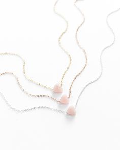 "𝗘𝗮𝘀𝘆 𝗧𝗼 𝗦𝘁𝘆𝗹𝗲, 𝗠𝗮𝗱𝗲 𝗧𝗼 𝗟𝗮𝘀𝘁 A perfect Valentine's Day gift, our dainty rose quartz gemstone necklaces are easy to layer and ready to be worn on repeat! Created to last a lifetime, these necklaces will remain evergreen even as the years and trends come and go. 𝗠𝗮𝘁𝗲𝗿𝗶𝗮𝗹𝘀 𝗪𝗲 𝗨𝘀𝗲 This necklace is made entirely with sturdy 14k yellow gold filled or sterling silver pieces and a genuine gemstone pendant. It is safe to wear in the shower, but we recommend avoiding prolonged exposure to chemicals like chlorine to keep your necklace like new! Our gemstones are not dyed or artificially colored in any way. The stones and their colors are completely genuine! 𝗟𝗲𝗻𝗴𝘁𝗵 𝗢𝗽𝘁𝗶𝗼𝗻𝘀 We have lengths between 14\" - 20\" available! Generally, we recommend 14\" length Minimalist Gemstone Jewelry For Valentine's Day, Dainty Rose Quartz Jewelry In Rose Gold, Minimalist Gemstone Necklace For Valentine's Day, Dainty Gemstone Heart Necklace, Delicate Gemstone Necklace For Valentine's Day, Minimalist Rose Quartz Jewelry For Gifts, Minimalist Rose Quartz Jewelry As Gift, Minimalist Rose Quartz Jewelry Gift, Dainty Rose Gold Heart Beads Necklace