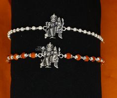 This amazing silver Rakhi crafted from 925 silver with immense precision. It exudes excellent craftsmanship and will surely look wonderful on your brother's wrist. handmade custom design God divine Bracelet Or Rakhi bracelet with silver, rudraksha and holy Basil Rosary beaded chain, this is special design beaded bracelet we can use either Rakhi bracelet or daily use bracelet for unisex. Best Rakshabandhan Festival best wishes sibling gift for your brother and sister's , Metal-925 sterling silver Silver Bracelet For Navratri Festival, Silver Bracelet For Navratri Festive Occasion, Silver Bracelets For Navratri, Festive Silver Bracelets For Navratri, Silver Temple Jewelry Bracelets For Ceremonial Occasions, Ceremonial Silver Temple Jewelry Bracelet, Silver Bracelet For Navratri Rituals, Silver Bracelets For Navratri Rituals, Silver Fusion Bracelets For Diwali