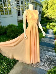 1970s Sunset Shimmer Maxi Gown. This one is a stunner!!! Maxi length, sleeveless with a nylon zip on the back. No label, but construction of the dress is very well down. Under layer is acetate with two layers of sunny chiffon and a peachy orange chiffon. I would call this a maxi fit and flare with a twirl skirt 🙂 Bust: 34” Waist: 28” Hips: 42” Length: 59” Price : $75 Orange Chiffon, Peachy Orange, Twirl Skirt, Modern Bracelets, Sunset Shimmer, Maxi Gown, No Label, Modern Necklaces, Maxi Gowns