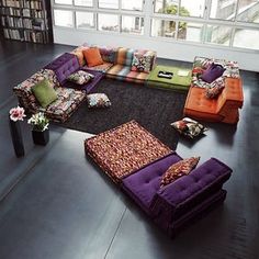 a living room filled with lots of colorful furniture