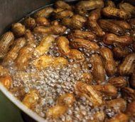 nuts are being cooked in a large pot