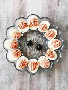 an overhead view of deviled eggs on a glass platter