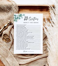 a wedding guest list on top of a table next to a pair of gold scissors