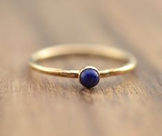 "Beautiful birthstone lapis lazuli stacking ring. Made in 14k gold filled and stones are 3mm. This ring is made to order in your size. If you don't see your size available please feel free to message me. Also available with garnet, carnelian, moonstone, turquoise, or simulated opal. Put your birthstone choice in \"Notes to Seller\" at checkout. Please message me for availability and pricing if interested in a stone not listed. All orders ship in a gift box. If you are ordering multiple items and Yellow Gold Lapis Lazuli Minimalist Jewelry, Minimalist Yellow Gold Lapis Lazuli Jewelry, Minimalist Round Lapis Lazuli Jewelry, September Birthstone Ring, September Birthstone Rings, Multiple Rings, Lapis Lazuli Ring, Ringe Gold, Gold Ring Stack