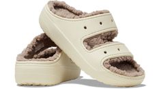 The new Classic Cozzzy Sandal features a soft, fuzzy liner, style-forward heightened outsoles and two upper straps that offer enhanced foot security. Seven holes on each sandal allow for maximum personalization with Jibbitz™ charms, while Croslite™ foam construction keeps them light and easy to wear.  Classic Cozzzy Sandal Details:    Warm, fuzzy liner  Two-strap upper  Style-forward heightened outsoles  Incredibly light and fun to wear  Croslite™ foam footbeds for lasting comfort  Customizable Classic Cozzzy Sandal, Saltwater Sandals, High Heel Slippers, Crocs Classic Clogs, Water Sandals, Muck Boots, Stylish Sandals, Heel Slippers, Flat Espadrilles