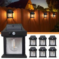 six solar powered outdoor lights in front of a wooden fence with the light turned on