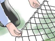 a person is pulling something out of a net with their hands on the net and another hand reaching for it