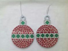 pair of red and green mosaic earrings hanging from silver earwires on white background